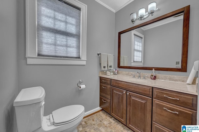 2910 W Meighan Blvd, Gadsden, AL 35904 - bathroom featuring baseboards, vanity, ornamental molding, and toilet