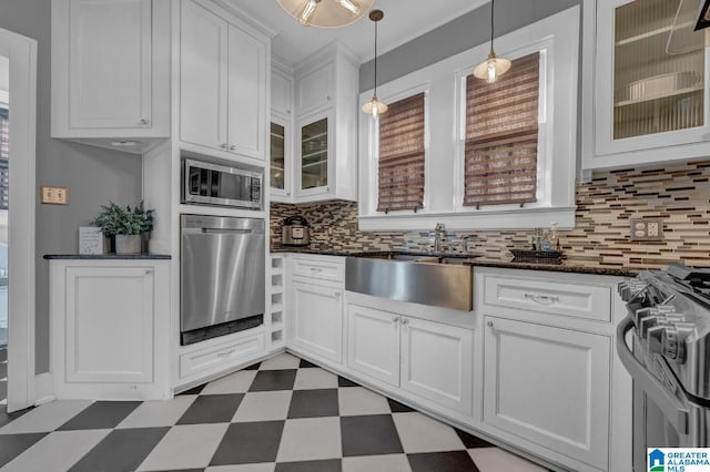 2910 W Meighan Blvd, Gadsden, AL 35904 - kitchen with tasteful backsplash, tile patterned floors, a sink, stainless steel appliances, and white cabinetry