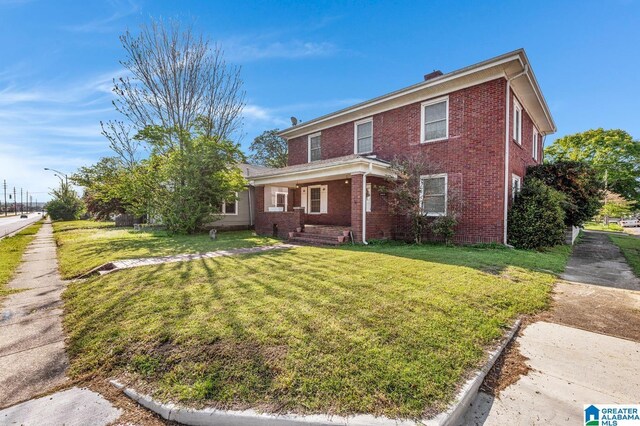 2910 W Meighan Blvd, Gadsden, AL 35904 - traditional-style home featuring a front lawn and brick siding