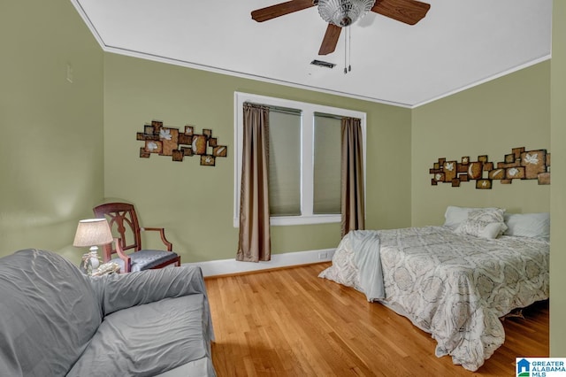 2910 W Meighan Blvd, Gadsden, AL 35904 - bedroom with crown molding, wood finished floors, and visible vents