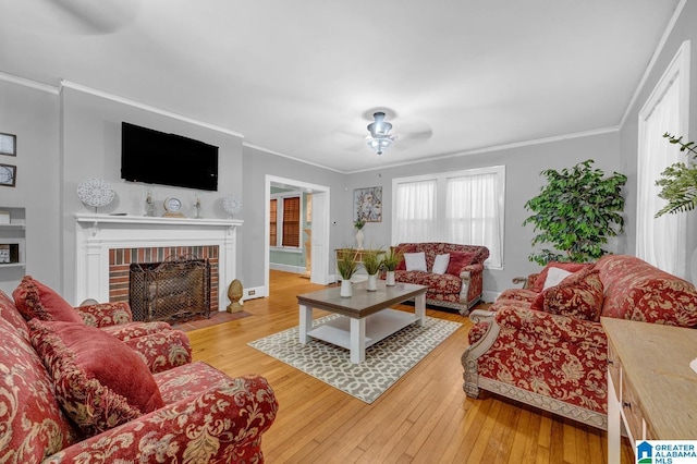 2910 W Meighan Blvd, Gadsden, AL 35904 - living area with hardwood / wood-style flooring, crown molding, and a brick fireplace