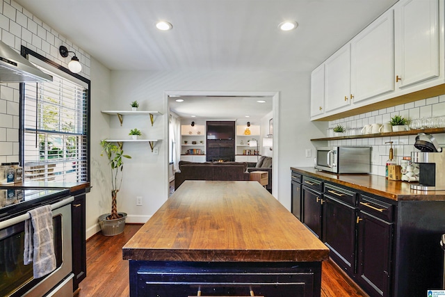 kitchen featuring open shelves, butcher block counters, recessed lighting, backsplash, and stainless steel appliances