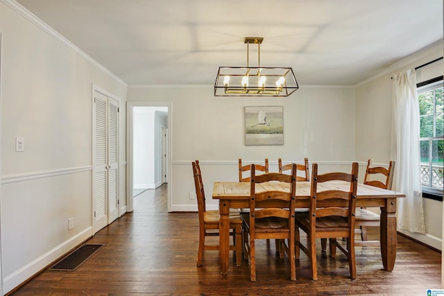dining area with ornamental molding, dark wood-type flooring, and visible vents