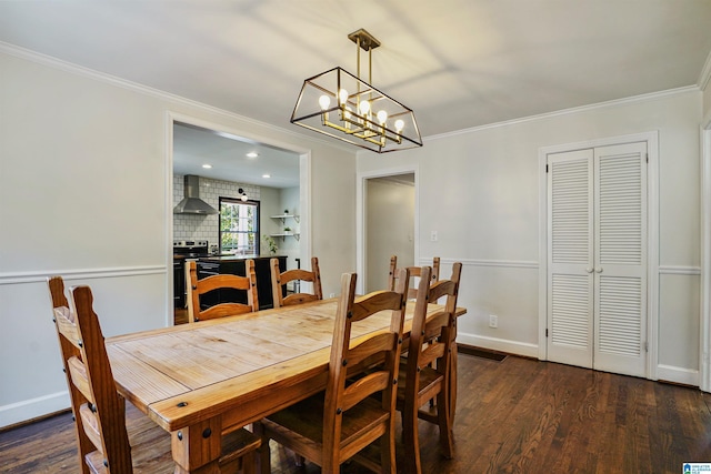 dining room with crown molding, dark wood finished floors, baseboards, a notable chandelier, and recessed lighting