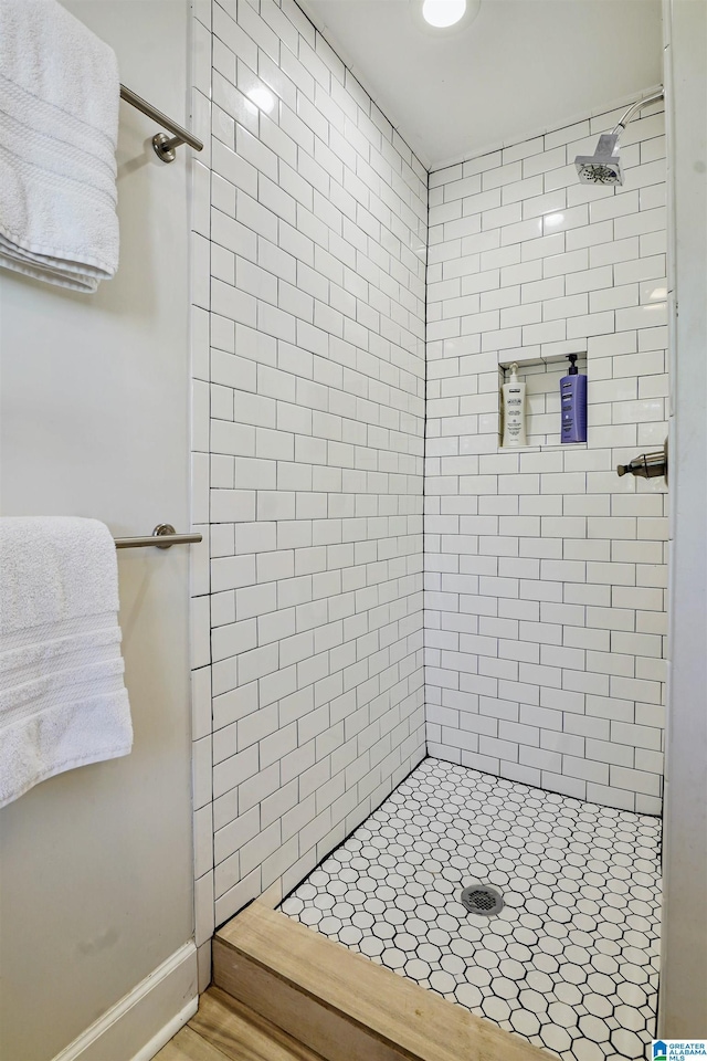 bathroom with tiled shower