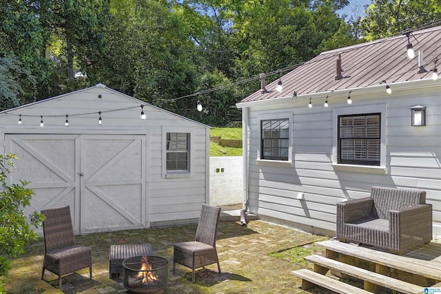 view of shed featuring an outdoor fire pit