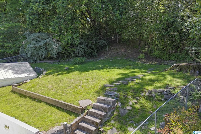view of yard featuring a deck and fence