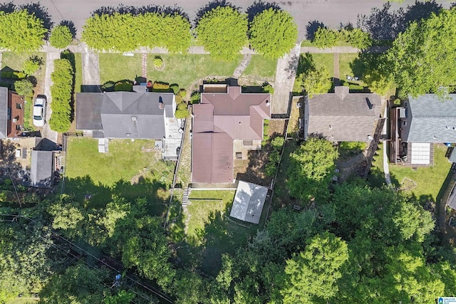 birds eye view of property with a residential view