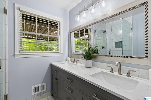 full bathroom with plenty of natural light, visible vents, and a sink