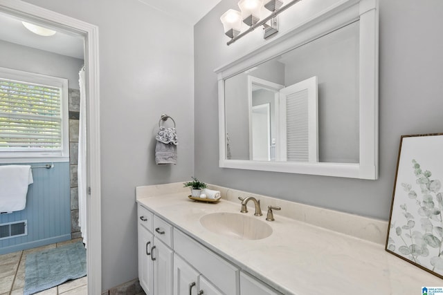 full bathroom with visible vents and vanity