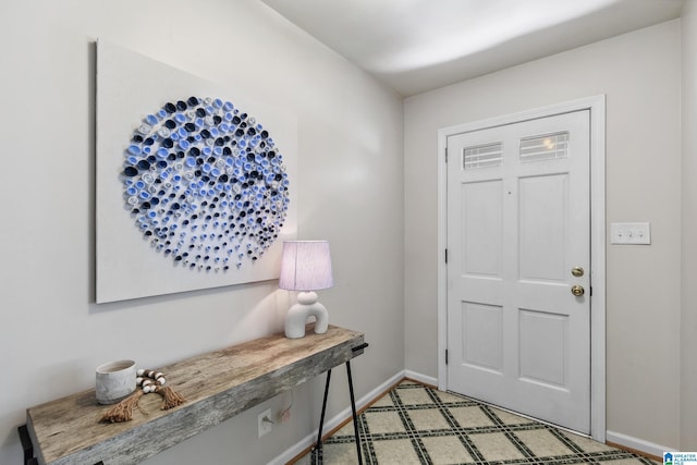 foyer entrance with baseboards