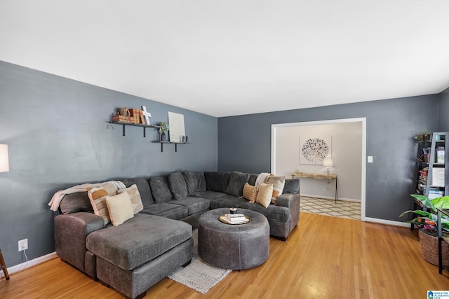 living room with light wood-style floors and baseboards