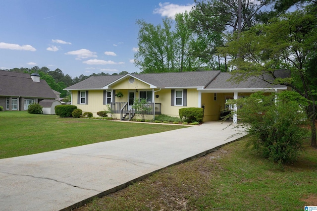 single story home with covered porch, a carport, a front lawn, and driveway