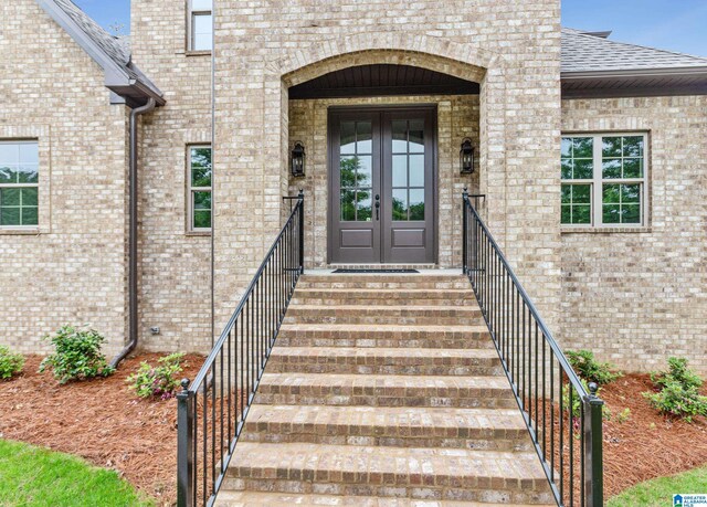2698 Piedmont Dr, Helena, AL 35022 - doorway to property with brick siding, french doors, and a shingled roof