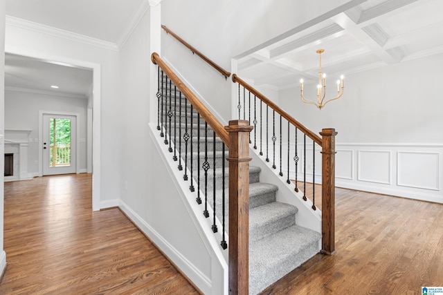 2698 Piedmont Dr, Helena, AL 35022 - stairway featuring coffered ceiling, beam ceiling, ornamental molding, wood finished floors, and a notable chandelier