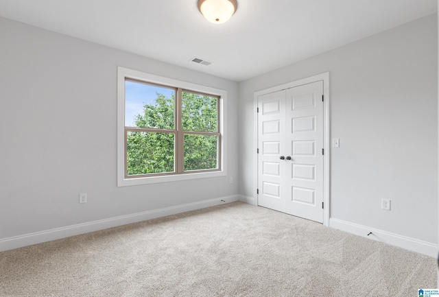 2698 Piedmont Dr, Helena, AL 35022 - unfurnished bedroom with visible vents, a closet, carpet flooring, and baseboards
