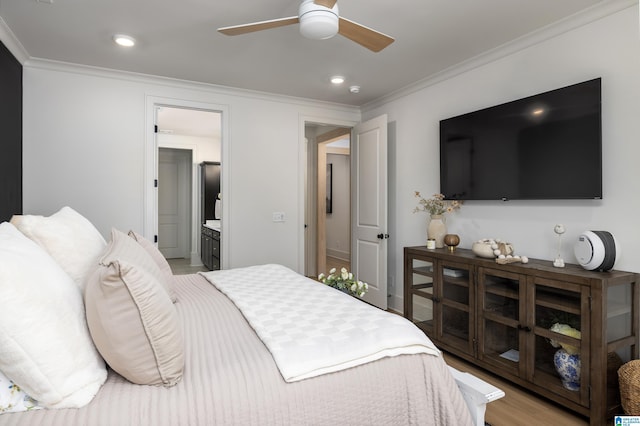 bedroom featuring crown molding, recessed lighting, connected bathroom, and light wood-style floors