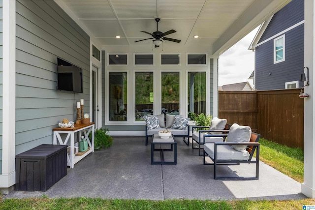 view of patio / terrace with an outdoor hangout area, ceiling fan, and fence