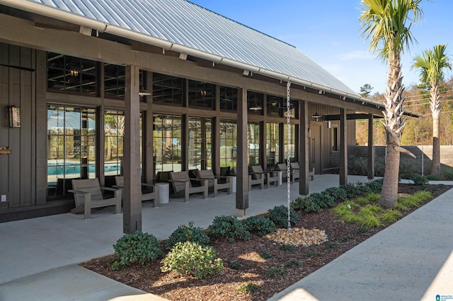 exterior space with a patio area, a swimming pool, and an outdoor living space