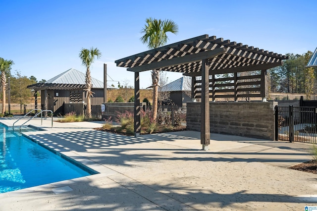 community pool featuring a pergola and fence