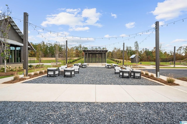 view of patio / terrace with a storage unit, outdoor lounge area, and an outbuilding