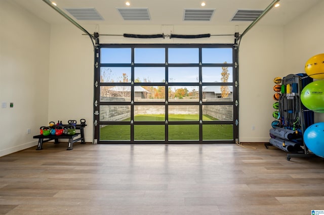garage featuring visible vents, recessed lighting, and baseboards