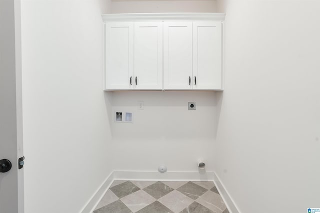 laundry room featuring hookup for an electric dryer, cabinet space, baseboards, hookup for a gas dryer, and washer hookup