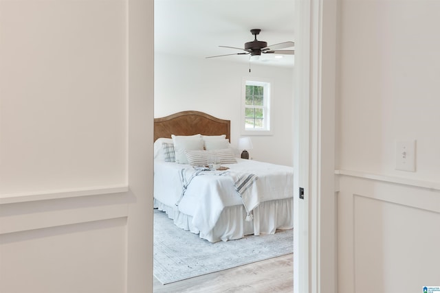 bedroom featuring wood finished floors and ceiling fan