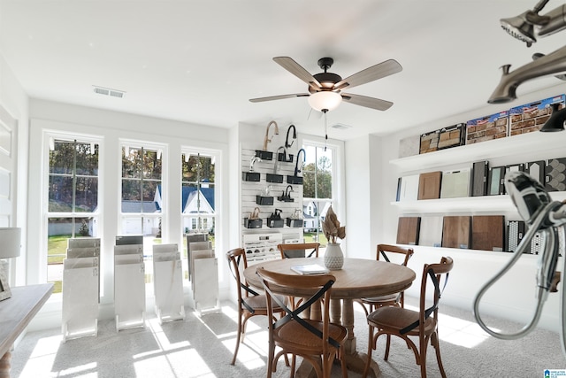 dining space featuring a ceiling fan and visible vents