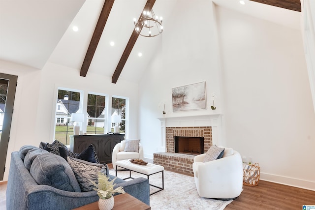 living area with high vaulted ceiling, an inviting chandelier, beamed ceiling, and recessed lighting