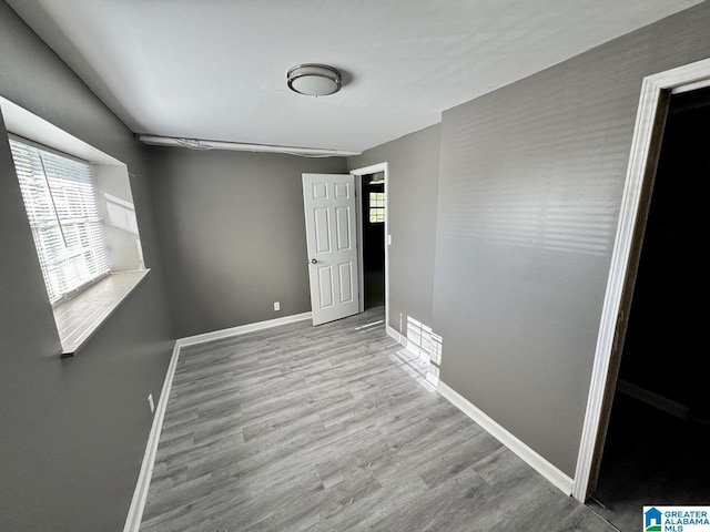 5835 Brenda Dr, Trussville, AL 35173 - spare room with baseboards, wood finished floors, and a healthy amount of sunlight