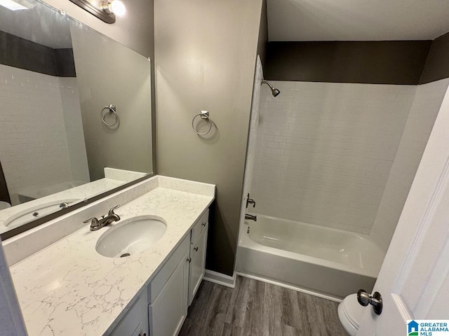 5835 Brenda Dr, Trussville, AL 35173 - full bath featuring shower / bath combination, wood finished floors, vanity, and toilet