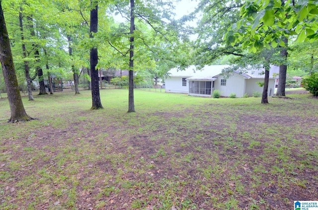 view of yard with a sunroom