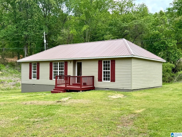 1474 Champion Rd, Oneonta, AL 35121 - rear view of property featuring crawl space, a deck, a yard, and metal roof