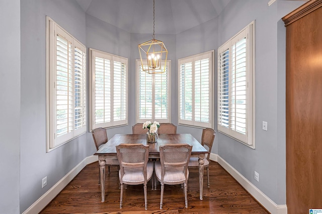 dining area with a healthy amount of sunlight, a notable chandelier, and baseboards