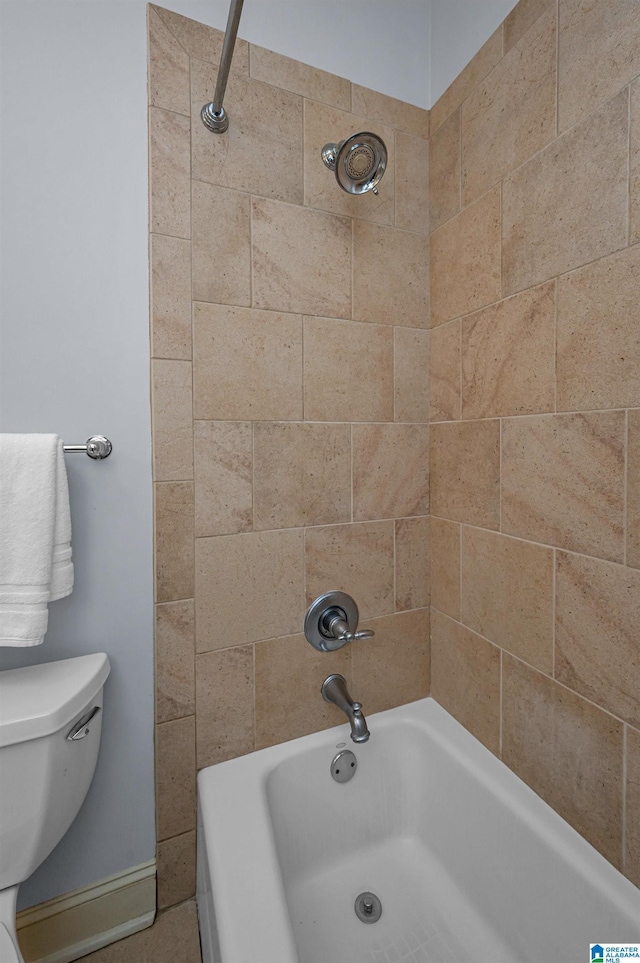 full bathroom featuring washtub / shower combination and toilet
