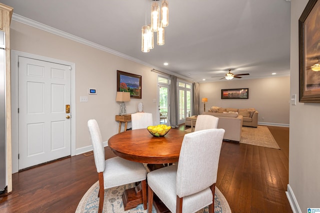 dining space with recessed lighting, dark wood-style flooring, and crown molding