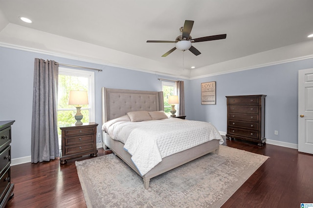 bedroom with baseboards, recessed lighting, dark wood-style flooring, and multiple windows