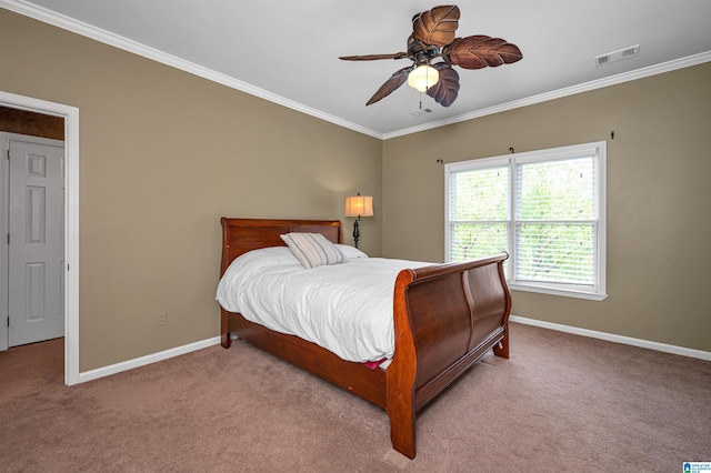 bedroom featuring baseboards, visible vents, carpet flooring, and crown molding