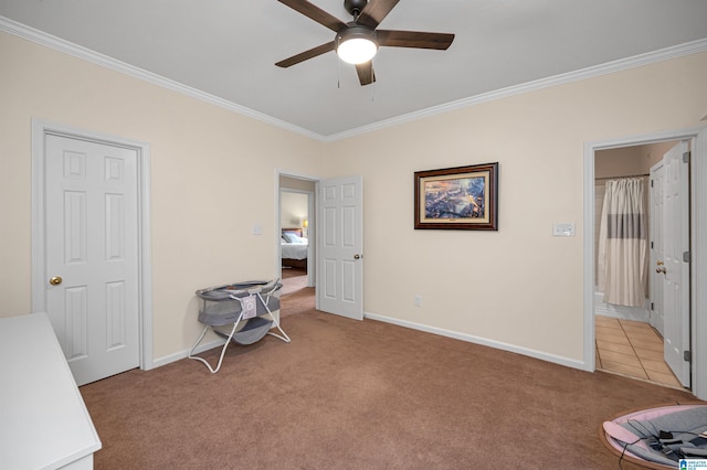 unfurnished bedroom with crown molding, a ceiling fan, light colored carpet, and baseboards