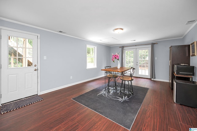 dining room with dark wood-type flooring, visible vents, french doors, and baseboards