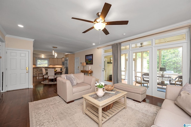 living area featuring wood finished floors, ceiling fan, recessed lighting, and ornamental molding