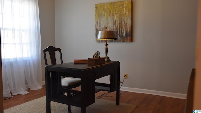 office with baseboards and wood finished floors