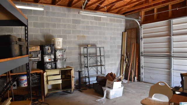 garage featuring concrete block wall