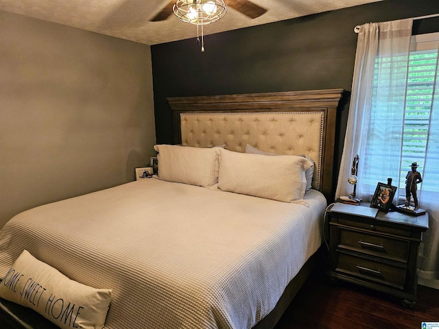 bedroom featuring a ceiling fan and wood finished floors