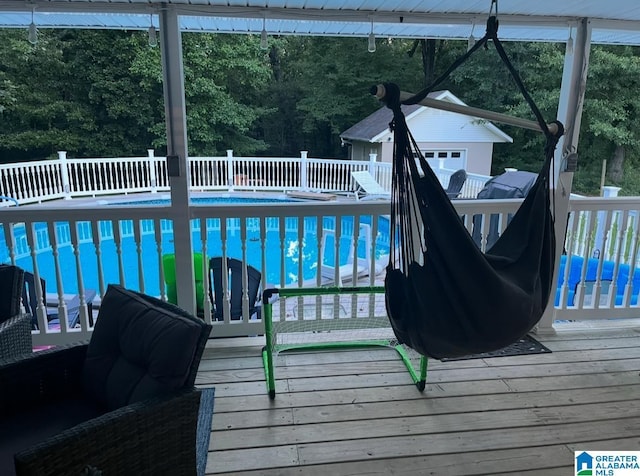 view of pool featuring a deck and a fenced in pool