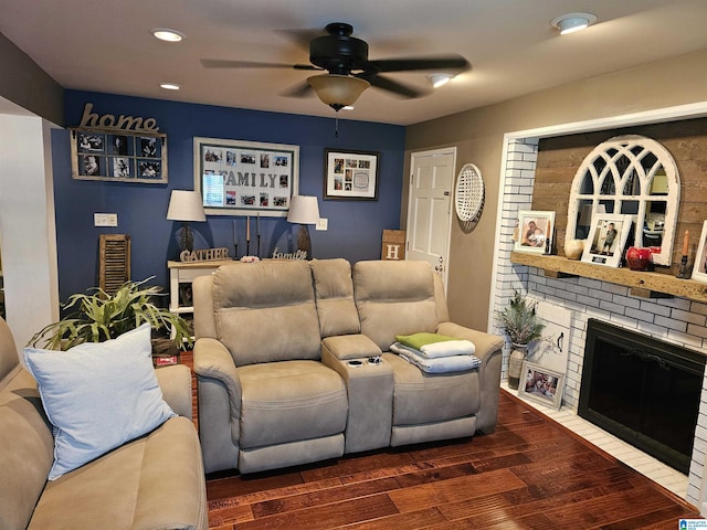 living area with wood finished floors, a fireplace, recessed lighting, and ceiling fan