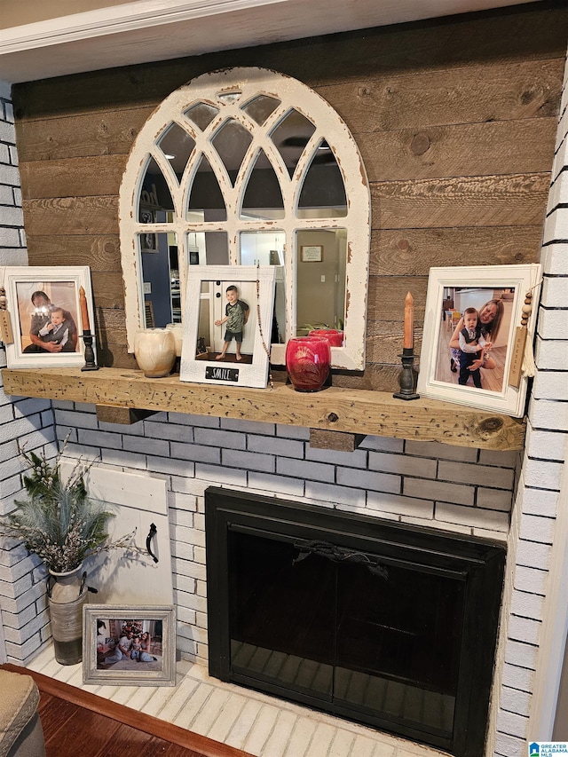 details featuring a brick fireplace