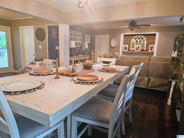 dining room featuring ceiling fan and dark wood-style flooring