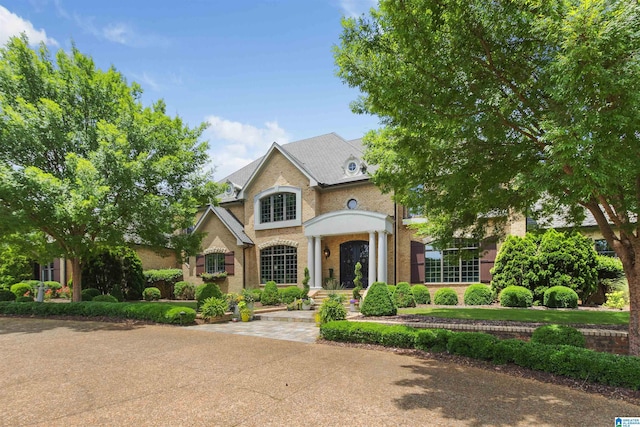 view of front of house with brick siding